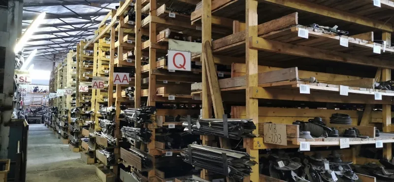 Rows of warehouse shelves marked with letters